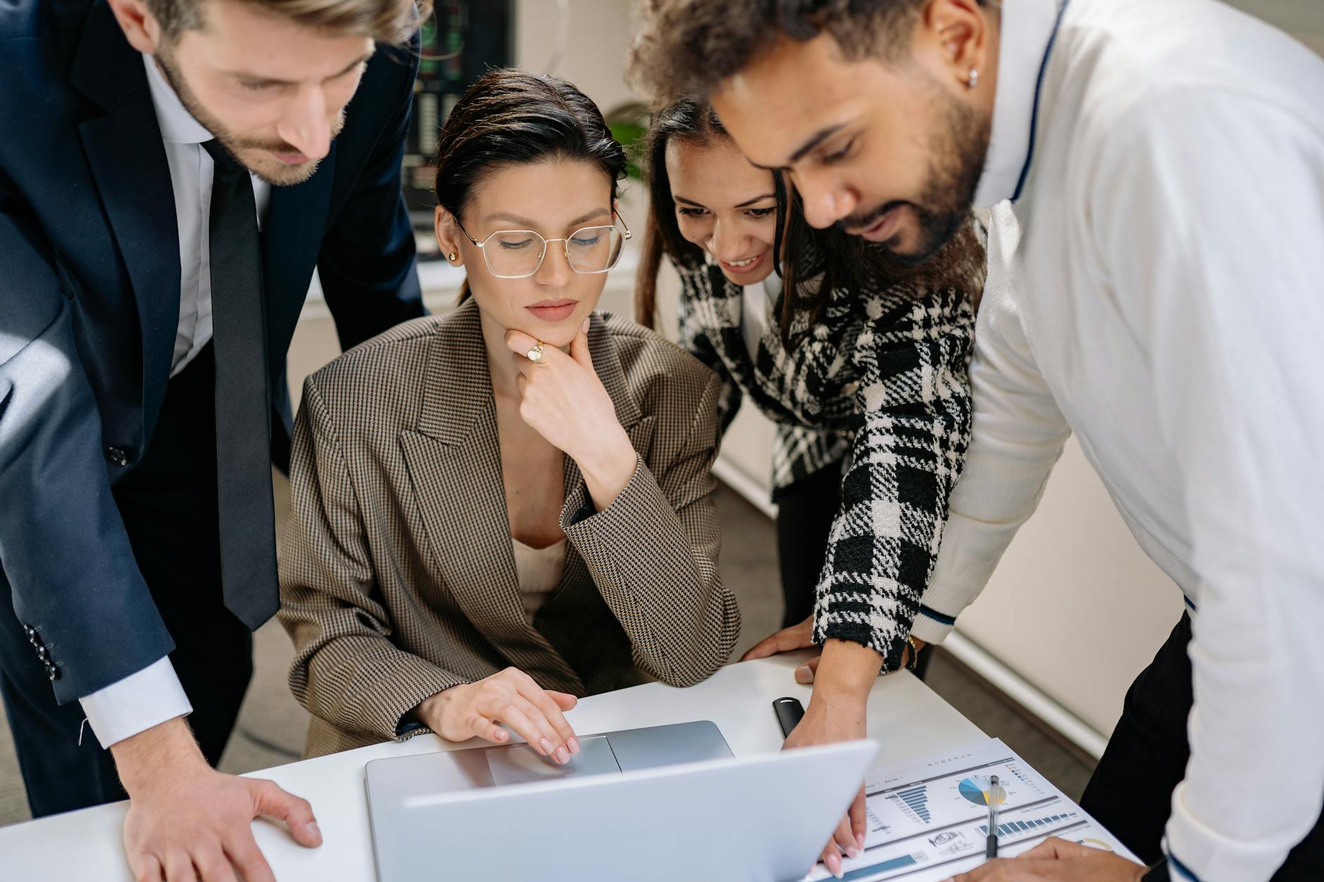 Team collaborating to slash project management costs using Agency OS AI